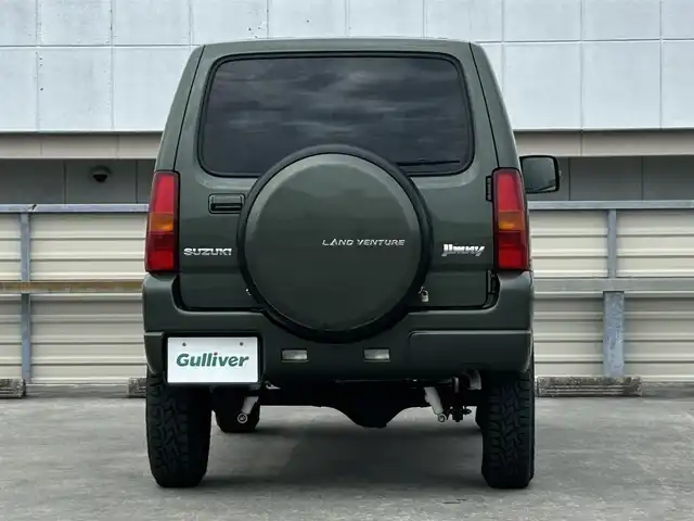 スズキ ジムニー ランドベンチャー 静岡県 2015(平27)年 9.4万km クールカーキPM 特別仕様車/５速ＭＴ/４ＷＤ/純正メモリナビ/フルセグＴＶ/ＤＶＤ再生/ＢＴオーディオ/ＥＴＣ/ハーフレザーシート/シートヒーター/背面タイヤ/ホワイトレタータイヤ/背面タイヤ・ハードカバー付き/ハロゲンヘッドライト/純正フロアマット/RAYS１６ＡＷ