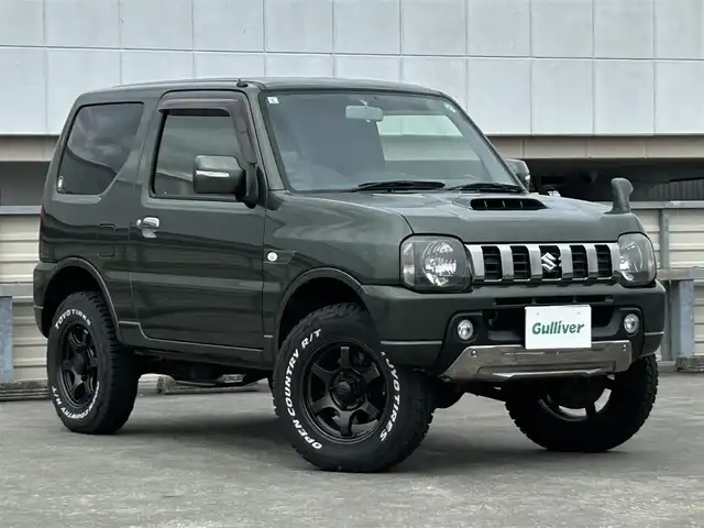 スズキ ジムニー ランドベンチャー 静岡県 2015(平27)年 9.4万km クールカーキPM 特別仕様車/５速ＭＴ/４ＷＤ/純正メモリナビ/フルセグＴＶ/ＤＶＤ再生/ＢＴオーディオ/ＥＴＣ/ハーフレザーシート/シートヒーター/背面タイヤ/ホワイトレタータイヤ/背面タイヤ・ハードカバー付き/ハロゲンヘッドライト/純正フロアマット/RAYS１６ＡＷ