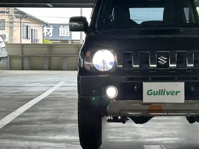 スズキ ジムニー ランドベンチャー 静岡県 2015(平27)年 9.4万km クールカーキPM 特別仕様車/５速ＭＴ/４ＷＤ/純正メモリナビ/フルセグＴＶ/ＤＶＤ再生/ＢＴオーディオ/ＥＴＣ/ハーフレザーシート/シートヒーター/背面タイヤ/ホワイトレタータイヤ/背面タイヤ・ハードカバー付き/ハロゲンヘッドライト/純正フロアマット/RAYS１６ＡＷ