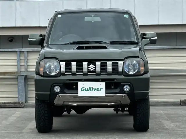 スズキ ジムニー ランドベンチャー 静岡県 2015(平27)年 9.4万km クールカーキPM 特別仕様車/５速ＭＴ/４ＷＤ/純正メモリナビ/フルセグＴＶ/ＤＶＤ再生/ＢＴオーディオ/ＥＴＣ/ハーフレザーシート/シートヒーター/背面タイヤ/ホワイトレタータイヤ/背面タイヤ・ハードカバー付き/ハロゲンヘッドライト/純正フロアマット/RAYS１６ＡＷ