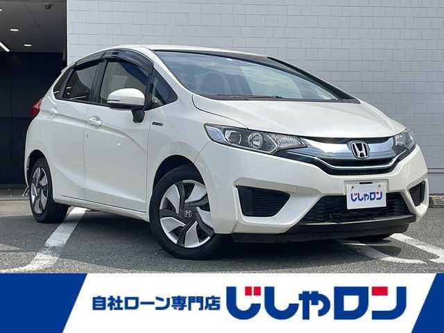 ホンダ フィット ハイブリット Fパッケージ 熊本県 2014(平26)年 1.8万km プレミアムホワイトパール (株)IDOMが運営する【じしゃロン熊本店】の自社ローン専用車両になります/こちらは現金またはオートローンご利用時の価格です。自社ローンご希望の方は別途その旨お申付け下さい./社外ナビ/バックカメラ/純正フロアマット/電動格納ミラー/ステアリングスイッチ/電動格納ミラー/スマートキープッシュスタート/LEDヘットライト