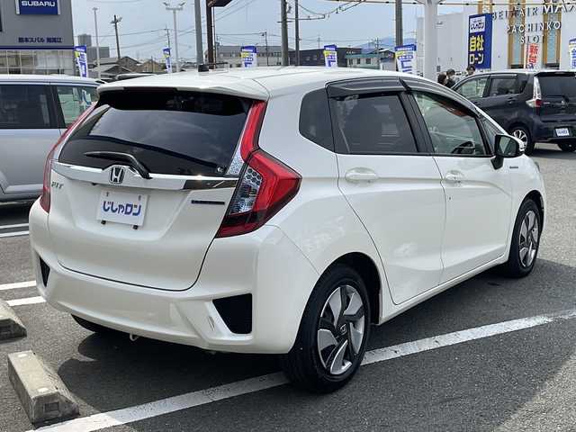 ホンダ フィット ハイブリット Fパッケージ 熊本県 2014(平26)年 1.8万km プレミアムホワイトパール (株)IDOMが運営する【じしゃロン熊本店】の自社ローン専用車両になります/こちらは現金またはオートローンご利用時の価格です。自社ローンご希望の方は別途その旨お申付け下さい./社外ナビ/バックカメラ/純正フロアマット/電動格納ミラー/ステアリングスイッチ/電動格納ミラー/スマートキープッシュスタート/LEDヘットライト