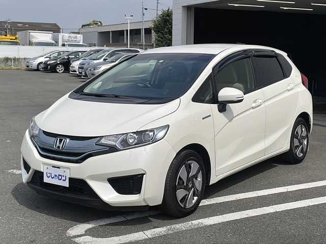 ホンダ フィット ハイブリット Fパッケージ 熊本県 2014(平26)年 1.8万km プレミアムホワイトパール (株)IDOMが運営する【じしゃロン熊本店】の自社ローン専用車両になります/こちらは現金またはオートローンご利用時の価格です。自社ローンご希望の方は別途その旨お申付け下さい./社外ナビ/バックカメラ/純正フロアマット/電動格納ミラー/ステアリングスイッチ/電動格納ミラー/スマートキープッシュスタート/LEDヘットライト