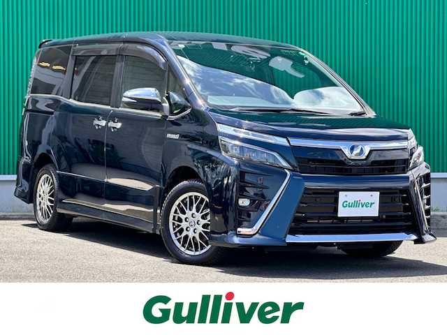 トヨタ ヴォクシー ハイブリッド ZS 煌Ⅱ 宮城県 2019(令1)年 2.5万km ブラッキッシュアゲハガラスフレーク セーフティセンス/・プリクラッシュセーフティ/・レーンディパーチャーアラート/・オートマチックハイビーム/・先行車発進告知機能/インテリジェントクリアランスソナー/純正12インチフリップダウンモニター（V12T-R68C）/純正10インチナビ（NSZN-Z68T）/・CD/DVD/・Bluetooth/・フルセグTV/バックカメラ/ビルトインETC/ドライブレコーダー/GPSレーダー探知機/両側パワースライドドア/前席シートヒーター/革巻きステアリング/クルーズコントロール/ステアリングスイッチ/LEDヘッドランプ/フォグランプ/オートライト/スマートキー＆プッシュスタート/スペアキー1本/電動格納ミラー/純正16インチAW/純正フロアマット/純正ドアバイザー/Wエアバッグ