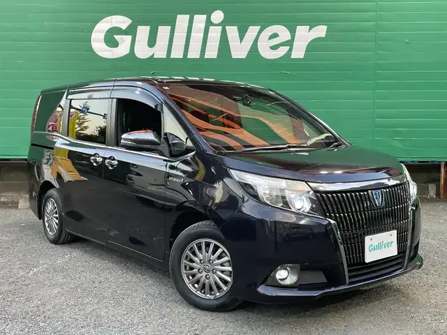 トヨタ エスクァイア ハイブリッド Gi ブラックテーラード 東京都 2016(平28)年 4.5万km スパークリングブラックパールクリスタルシャイン 純正9インチナビ（NSZT-Y66T）/・フルセグTV/DVD/Bluetoothオーディオ/両側電動スライドドア/バックカメラ/ドライブレコーダー前後/トヨタセーフティセンスC/・プリクラッシュセーフティシステム/・レーンディパーチャーアラート/・オートマチックハイビーム/合皮シート/前席シートヒーター/純正15インチアルミホイール/保証書/取扱説明書/スペアキー