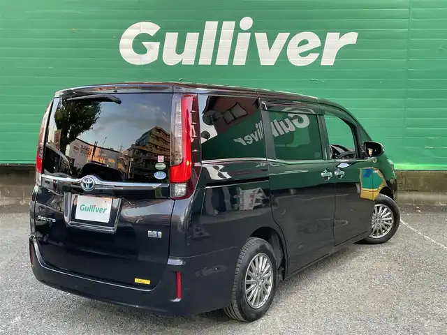 トヨタ エスクァイア ハイブリッド Gi ブラックテーラード 東京都 2016(平28)年 4.5万km スパークリングブラックパールクリスタルシャイン 純正9インチナビ（NSZT-Y66T）/・フルセグTV/DVD/Bluetoothオーディオ/両側電動スライドドア/バックカメラ/ドライブレコーダー前後/トヨタセーフティセンスC/・プリクラッシュセーフティシステム/・レーンディパーチャーアラート/・オートマチックハイビーム/合皮シート/前席シートヒーター/純正15インチアルミホイール/保証書/取扱説明書/スペアキー