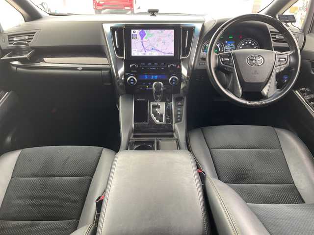 トヨタ ヴェルファイア ハイブリット Z ゴールデンアイズ 兵庫県 2021(令3)年 6.5万km ホワイトパールクリスタルシャイン ・純正ナビCD/DVD/USB/Miracast/Bluetooth/TV/HDMI/・純正フリップダウンモニター/・バックカメラ/・ビルトインETC/・モデリスタエアロ（F.S.R）/・前後ドライブレコーダー/・両側パワースライドドア/・パワーバックドア/・Toyota　Safety　Sense/・プリクラッシュセーフティ/・レーントレーシングアシスト/・レーダークルーズコントロール（全車速追従機能付）/・ロードサインアシスト/・アダプティブハイビームシステム/・先行車発進告知/・三眼ＬＥＤヘッドライト/・フォグランプ/・AC100V電源/・純正アルミホイール/・社外フロアマット/・社外レーダー探知機/・ウッドコンビステアリング/・スマートキー/・スペアキー