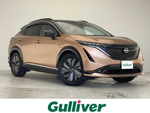 日産 アリア B6 愛知県 2023(令5)年 2.1万km オレンジ プロパイロット/衝突軽減システム/純正12.4型ディズプレイオーディオ　ナビ機能あり/全方位カメラ/クルーズコントロール/シートヒーター　全席/フルセグ/Bluetooth/バックカメラ/電動リアゲート/パワーシート/コーナーセンサー/純正アルミホイール/ルーフレール/ETC2.0/ブラインドスポットモニター/LEDヘッドライト/ステアリングヒーター/インテリジェントミラー/オートマチックハイビーム/ドライブレコーダー/置くだけ充電機/ステアリングスイッチ/スマートキー/プッシュスタート