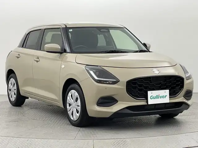 スズキ スイフト XG 新潟県 2024(令6)年 0.4万km キャラバンアイボリーPM 禁煙車/スズキセーフティサポート/純正ディスプレイオーディオ/　　AM/FM/BT/androidauto/applecarplay/アダプティブクルーズコントロール/前席シートヒーター/LEDオートライト/ステアリングスイッチ/ヘッドライトレベライザー/ブラインドスポットモニター/スペアキー/スマートキー