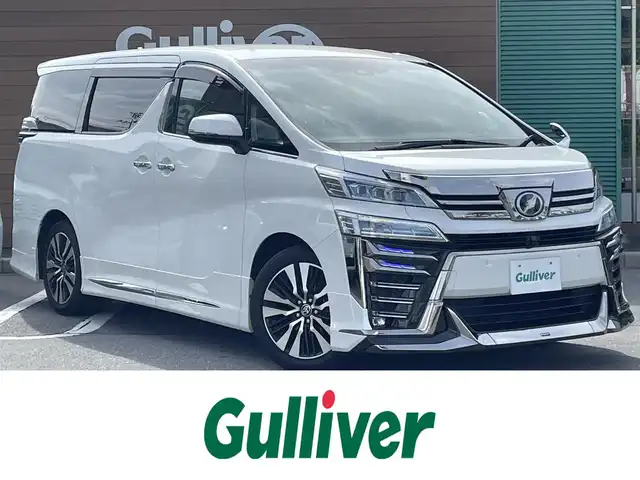 トヨタ ヴェルファイア Z Gエディション 長野県 2019(令1)年 3.4万km ホワイトパールクリスタルシャイン 社外ナビ（FM/AM、CD、DVD、BT、USB）/バックカメラ/フルセグテレビ/クルーズコントロール追従有/ビルトインETC2.0/電動リアゲート/レーンキープアシスト/ALPINEフリップダウンモニター/全席パワーシート/前席シートヒーター/フルモデリスタ/盗難防止装置/衝突軽減システム/前方ドライブレコーダー/純正フロアマット/純正１８AW/後部席サンシェード/前席シートヒーター/前席エアシート/メモリシート/ステアリングヒーター/両側パワースライドドア/前後コーナーセンサー/電動リアゲート/革ステアリング/オットマン/スペアキー（１本）/LEDオートライト/オートマチックハイビーム/ダブルサイドエアバック/カーテンエアバック/カーアロマ/エンジンスターター/保証書、取扱説明書/スペアキー（１本）