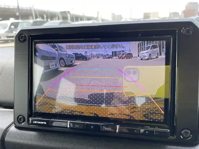 スズキ ジムニー XC 石川県 2022(令4)年 0.9万km ジャングルグリーン 4WD/ターボ/社外8型メモリーナビ/フルセグTV/バックカメラ/LEDヘッドライト/ETC/純正アルミホイール/レーダーブレーキ/シートヒーター/スマートキー/プッシュスタート/電動ミラー/クルーズコントロール/社外グリル/保証書