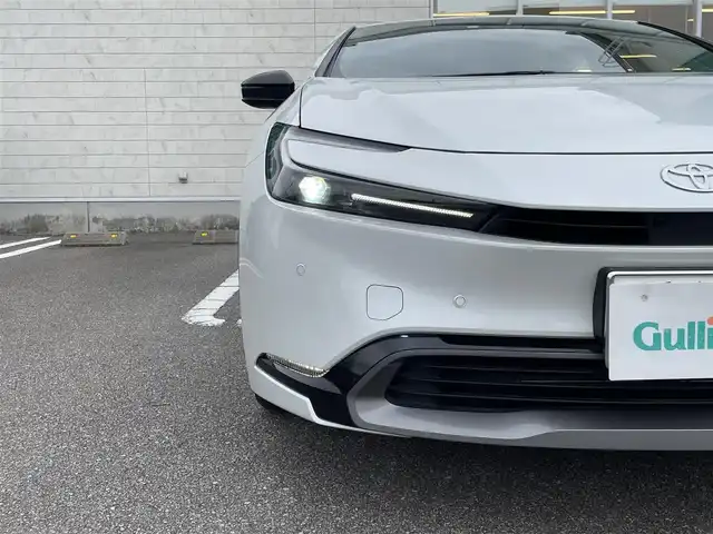 トヨタ プリウス Z 宮崎県 2023(令5)年 5.3万km 白 12.3イン純正ディスプレイオーディオ/全周囲モニター/前席シートヒーター＆エアシート/ステアリングヒーター/レーダークルーズコントロール/ワイヤレス充電/ドライブレコーダー（SDなし）/ブラインドスポットモニター/ETC2.0/電動リアゲート/ステアリングリモコン/オービスレーダー（AR-47LA）/パーキングアシストコントロール/トノカバー