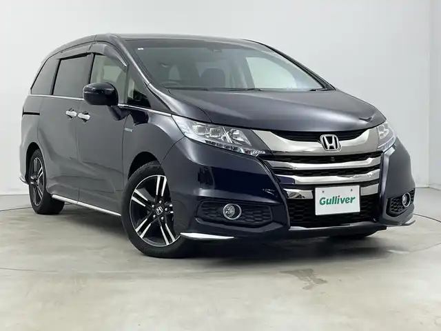 ホンダ オデッセイ ハイブリッド アブソルートセンシングアドバンP 新潟県 2017(平29)年 5.9万km プレミアムヴィーナスブラックP 純正メモリナビ/　フルセグTV/Bluetooth/CD/DVD/HDMI/ホンダセンシング/・衝突軽減ブレーキ(CMBS)/・車線維持支援システム(LKAS)/・アダプティブクルーズコントロール(ACC)/・後方誤発進抑制機能/・誤発進抑制機能/全方位モニター/両側パワースライドドア/ハーフレザーシート/運転席パワーシート/ETC/レザーステアリング/ステアリングスイッチ/LEDヘッドライト/純正17インチアルミホイール