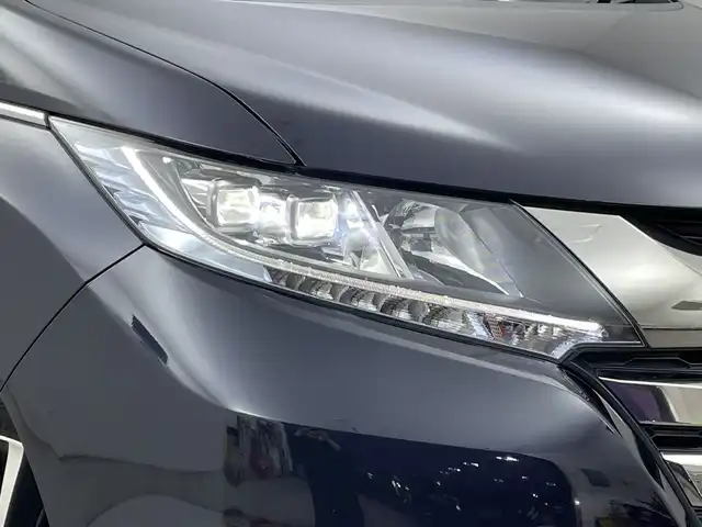 ホンダ オデッセイ ハイブリッド アブソルートセンシングアドバンP 新潟県 2017(平29)年 5.9万km プレミアムヴィーナスブラックP 純正メモリナビ/　フルセグTV/Bluetooth/CD/DVD/HDMI/ホンダセンシング/・衝突軽減ブレーキ(CMBS)/・車線維持支援システム(LKAS)/・アダプティブクルーズコントロール(ACC)/・後方誤発進抑制機能/・誤発進抑制機能/全方位モニター/両側パワースライドドア/ハーフレザーシート/運転席パワーシート/ETC/レザーステアリング/ステアリングスイッチ/LEDヘッドライト/純正17インチアルミホイール