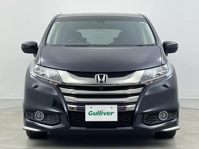 ホンダ オデッセイ ハイブリッド アブソルートセンシングアドバンP 新潟県 2017(平29)年 5.9万km プレミアムヴィーナスブラックP 純正メモリナビ/　フルセグTV/Bluetooth/CD/DVD/HDMI/ホンダセンシング/・衝突軽減ブレーキ(CMBS)/・車線維持支援システム(LKAS)/・アダプティブクルーズコントロール(ACC)/・後方誤発進抑制機能/・誤発進抑制機能/全方位モニター/両側パワースライドドア/ハーフレザーシート/運転席パワーシート/ETC/レザーステアリング/ステアリングスイッチ/LEDヘッドライト/純正17インチアルミホイール