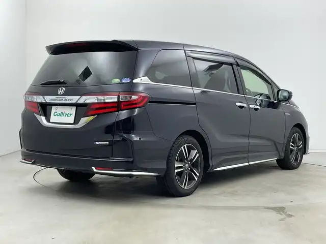 ホンダ オデッセイ ハイブリッド アブソルートセンシングアドバンP 新潟県 2017(平29)年 5.9万km プレミアムヴィーナスブラックP 純正メモリナビ/　フルセグTV/Bluetooth/CD/DVD/HDMI/ホンダセンシング/・衝突軽減ブレーキ(CMBS)/・車線維持支援システム(LKAS)/・アダプティブクルーズコントロール(ACC)/・後方誤発進抑制機能/・誤発進抑制機能/全方位モニター/両側パワースライドドア/ハーフレザーシート/運転席パワーシート/ETC/レザーステアリング/ステアリングスイッチ/LEDヘッドライト/純正17インチアルミホイール