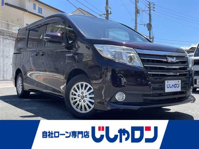 トヨタ ノア ハイブリッド G 福岡県 2015(平27)年 11.9万km ボルドーマイカメタリック (株)IDOMが運営する【じしゃロン八幡西店】の自社ローン専用車両になります。こちらは現金またはオートローンご利用時の価格です。自社ローンご希望の方は別途その旨お申付け下さい/・純正ナビ（NSZT-Y64T）/・Bluetooth/・バックカメラ/・片側パワースライド/・ドライブレコーダー/・ETC/・前席シートヒーター/・プッシュスタート/・スマートキー/・純正フロアマット