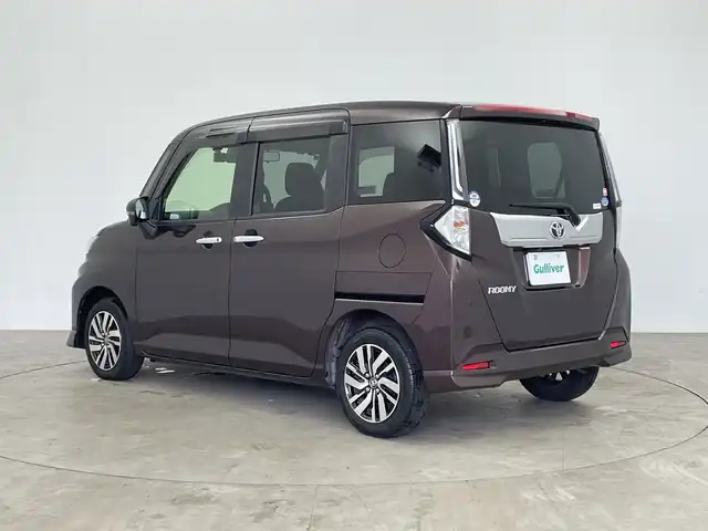 トヨタ ルーミー カスタムG 鹿児島県 2020(令2)年 6.8万km プラムブラウンパールクリスタルシャイン 純正9インチナビ/（AM/FM/CD/DVD/Bluetooth）/パノラミックビューモニター/前後ドライブレコーダー/レーダークルーズコントロール/両側パワースライドドア/ビルトインETC/オートライト/シートヒーター/純正フロアマット/ドアバイザー/LEDヘッドライト/シートバックテーブル/オートホールド/電子パーキングブレーキ/スマートキー /アイドリングストップ