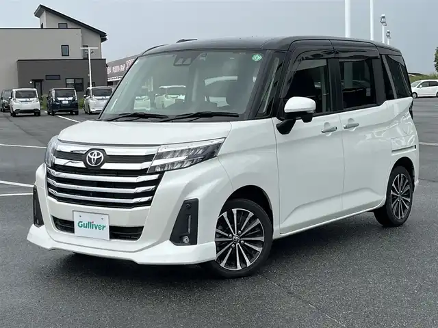 トヨタ ルーミー カスタムG－T 奈良県 2021(令3)年 2.2万km ブラックマイカメタリック/パールホワイト2トーン 純正9インチナビ（NSZT-Y68T）/（フルセグ/BT/CD/DVD)/レーダークルーズコントロール/アラウンドビューモニター/前後コーナーセンサー/プリクラッシュセーフティ/レーンキープアシスト/両側パワースライドドア/前席シートヒーター/後席サンシェード/ETC2.0/前方ドライブレコーダー/純正15インチAW/保証書/取り扱い説明書/スペアキーX1