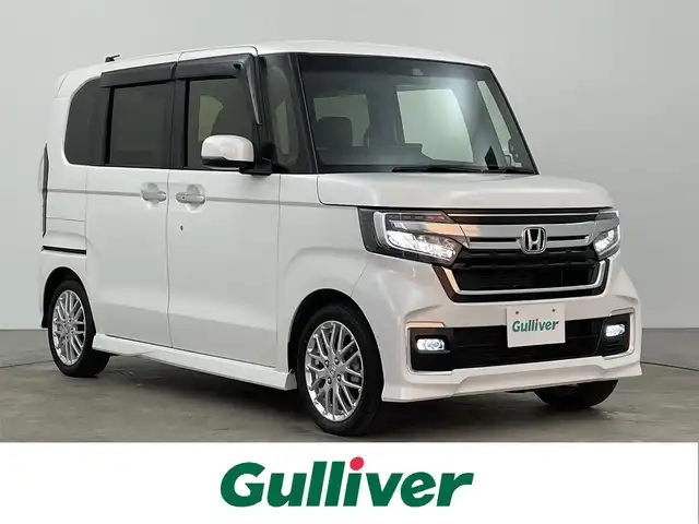 ホンダ Ｎ ＢＯＸ カスタム L ターボ 大分県 2023(令5)年 1.5万km プラチナホワイトパール 純正ナビ/バックカメラ/ホンダセンシング/衝突軽減ブレーキ/車線逸脱防止システム/リアコーナーセンサー/LEDヘッドライト/オートライト/両側パワースライドドア/前席シートヒーター/ハーフレザーシート/フルセグTV/ビルトインETC/スマートキー/Bluetooth/純正フロアマット/純正15インチアルミホイール/ベンチシート