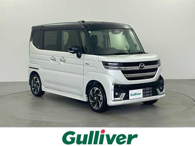 マツダ フレアワゴン カスタムスタイル XS 栃木県 2024(令6)年 2.7万km パールⅡ 純正９インチナビ/（DVD/CD/Bluetooth/Apple carplay/Android auto)/全周囲カメラ/サポカーS・ワイド/・デュアルセンサーブレーキサポート/・車線逸脱抑制/・標識認識/・先行車発進お知らせ/・低車速支援/・ペダル踏み間違い時加速抑制装置/両側パワースライドドア/ETC 2.0/アダプティブクルーズコントロール/ヘッドアップディスプレイ/ユピテル製 前後ドライブレコーダー/・SN-TW72d/本革巻きステアリング/ステアリングヒーター/ハーフレザーシート/前席シートヒーター/後席オットマン/スリムサーキュレーター/パーソナルテーブル/シーケンシャルウインカー/オートリトラミラー/オートライト/ハイビームアシスト/フォグライト/純正フロアマット/スペアキー/プッシュスタート