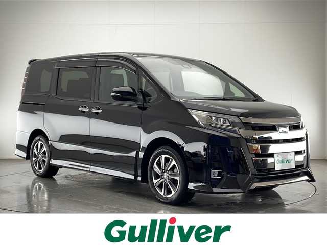 トヨタ ノア Si ダブルバイビーⅡ 宮崎県 2019(令1)年 6.1万km ブラック Toyota Safety Sense/〇プリクラシュセーフティ/〇レーンディパーチャーアラート/〇パーキングサポートブレーキ/〇オートマチックハイビーム/〇先行車発進告知/〇クリアランスソナー/社外7インチSDナビ/フルセグTV/CD/DVD/Bluetooth/社外10.2インチ後席フリップダウンモニター（TVM-FW1020）/両側パワースライドドア/クルーズコントロール/ハーフレザーシート/LEDヘッドライト/ビルトインETC/純正16インチAW/アイドリングストップ/スマートキー×２/取扱説明書
