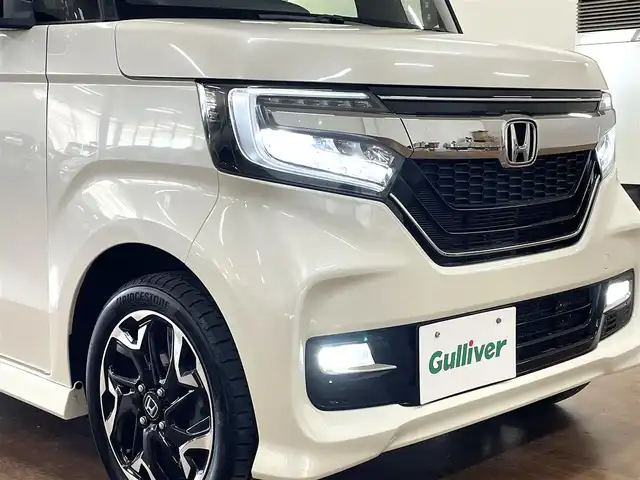 ホンダ Ｎ ＢＯＸ カスタム G L ターボ ホンダセンシング 道央・札幌 2018(平30)年 3.6万km プレミアムホワイトパールⅡ 4WD/ターボ/純正8インチSDナビ/フルセグTV/Bluetooth/CD/DVD/SD/バックカメラ/衝突軽減ブレーキ/レーンキープ/横滑り防止/両側パワースライドドア/ハーフレザーシート/シートヒーター（D/N）/ミラーヒーター/レーダークルーズコントロール/パドルシフト/オートライト/USBソケット/ビルトインETC/LEDヘッドライト/フォグランプ/プッシュスタート/スマートキー×2/純正エンジンスターター/純正15インチAW/後席サンシェード/取扱説明書