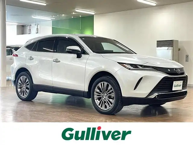トヨタ ハリアー Z レザーパッケージ 道央・札幌 2024(令6)年 0.2万km プラチナホワイトパールマイカ 4WD/寒冷地仕様/純正OP12.3型ナビ/・フルセグTV/BT/USB/AM/FM/JBLサウンドシステム/TVキャンセラー/バックカメラ/デジタルインナーミラー/トヨタセーフティセンス/・プリクラッシュセーフティ/・レーントレーシングアシスト/・レーンディパーチャーアラート/・ロードサインアシスト/・発進遅れ告知機能/・プロアクティブドライビングアシスト/・緊急時操舵支援機能/横滑り防止装置/前後コーナーセンサー/ブラインドスポットモニター/ヘッドアップディスプレイ/本革シート/前席パワーシート/運転席シートメモリ機能/前席シートベンチレーション/前席シートヒーター/置くだけ充電/AC100V電源/電動パーキングブレーキ/ブレーキホールド/レーダークルーズコントロール/パワーバックドア/純正エンジンスターター/ビルトインETC2.0/オートライト/アダプティブハイビーム/LEDヘッドライト/前後フォグライト/ステアリングリモコン/ステアリングヒーター/フロアマット/純正ドアバイザー/スマートキーx2/純正19インチAW/新車時保証書/取扱説明書