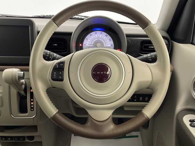スズキ ラパン ＬＣ X 宮崎県 2022(令4)年 0.7万km ソフトベージュメタリック スズキセーフティサポート/・デュアルカメラブレーキサポート/・誤発進抑制機能/・車線逸脱抑制機能/・車線逸脱警報機能/・ふらつき警報機能/・先行車発進お知らせ機能/・標識認識機能/・ハイビームアシスト/純正14インチAW/ハーフレザーシート/シートヒーター/USBソケット/オートライト/LEDライト/プッシュスタート/スマートキー