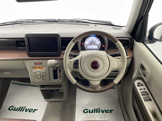 スズキ ラパン ＬＣ X 宮崎県 2022(令4)年 0.7万km ソフトベージュメタリック スズキセーフティサポート/・デュアルカメラブレーキサポート/・誤発進抑制機能/・車線逸脱抑制機能/・車線逸脱警報機能/・ふらつき警報機能/・先行車発進お知らせ機能/・標識認識機能/・ハイビームアシスト/純正14インチAW/ハーフレザーシート/シートヒーター/USBソケット/オートライト/LEDライト/プッシュスタート/スマートキー
