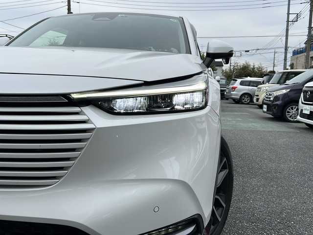 ホンダ ヴェゼル ハイブリッド e:HEV Z 埼玉県 2022(令4)年 3.3万km プラチナホワイトパール ワンオーナー/運転席エアバッグ	/助手席エアバッグ	/サイドエアバッグ	/ABS(アンチロックブレーキ)/トラクションコントロール	/前席シートベルトプリテンショナー	/前席シートベルトフォースリミッター/後席３点式シートベルト	/ブレーキアシスト	/衝突安全ボディー	採用/EBD（電子制動力配分装置）	/盗難防止システム	/その他安全装備	VSA(ABS+TCS+横すべり抑制) ヒルディセントコントロール/エアコン	フルオート/パワーウィンドウ	/集中ドアロック	/ステアリングテレスコピック機構	/ステアリングチルト機構	/クルーズコントロール	/本革巻きステアリング	/アルミホイール	18インチ標準/分割可倒式リアシート	分割式/UVカットガラス	/プライバシーガラス