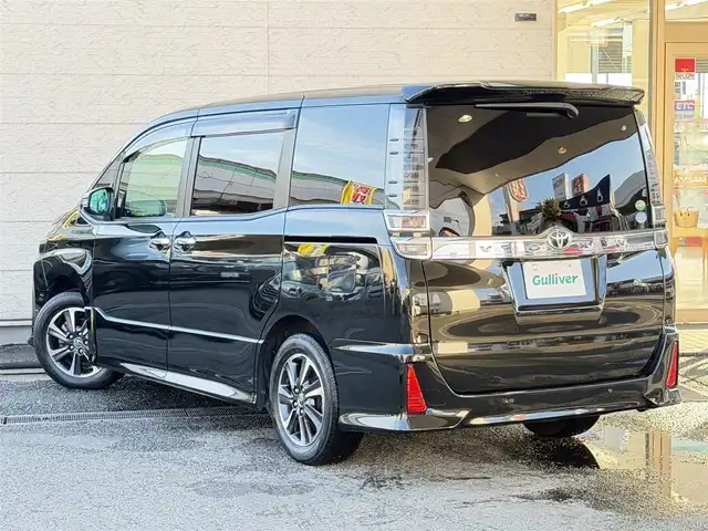 トヨタ ヴォクシー ZS 煌Ⅱ 兵庫県 2019(令1)年 3.6万km イナズマスパーキングブラックガラスフレーク 社外8インチナビ（Bluetooth接続/AM/FM/CD/DVD/フルセグTV）/社外ビルトインETC/バックカメラ/クルーズコントロール/両側パワースライドドア/トヨタセーフティセンス/純正16インチアルミホイール/スマートキー/前後ドライブレコーダー/コーナーセンサー/レーンキープアシスト/横滑り防止装置/盗難防止装置/衝突被害軽減システム/オートマチックハイビーム