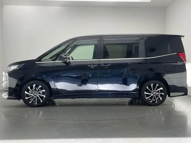 トヨタ ノア ハイブリッド S－Z 愛知県 2023(令5)年 3.5万km アティチュードブラックマイカ 純正１０．５型ナビ　ＢＳＭ　禁煙車　快適利便Ｈｉｇｈ　ＤＶＤデッキ　シートヒーター　ハンドルヒーター　電動リアゲート　両側パワスラ　ＡＣ１００Ｖ電源　前後ドラレコ　セーフティセンス　衝突軽減　ＬＥＤオートライト　フォグランプ　追従クルコン　コーナーセンサー　フォグランプ　USB　タイプC　オットマン　ハーフレザー　電動パーキング　オートホールド