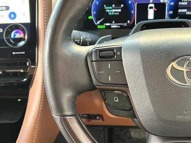 トヨタ ヴェルファイア ハイブリット Z プレミア 広島県 2024(令6)年 1.7万km プラチナホワイトパールマイカ 左右独立ムーンルーフ/トヨタチームメイト/・アドバンストパーク/・パーキングサポートブレーキ（周辺静止物）/・アドバンストドライブ/・緊急時操舵支援/・フロントクロストラフィックアラート/・レーンチェンジアシスト/・ドライバーモニターカメラ/セーフティセンス/・プリクラッシュセーフティ/・レーントレーシングアシスト/・全車速追従機能付レーダークルーズコントロール/・アダプティブハイビームシステム/・ロードサインアシスト/・ドライバー異常時対応システム/・プロアクティブドライビングアシスト/・発進遅れ告知機能/BSM/パーキングサポートブレーキ/デジタルインナーミラー/ドラレコ/純正14インチディスプレイオーディオナビ/・地デジTV/・ETC2.0/パノラミックビューモニター/HUD/両側パワースライドドア/パワーバックドア/サンセットブラウンプレミアムナッパ革シート/シートヒーター/ベンチレーション/パワーシート/メモリーシート/ステアリングヒーター/ステアリングスイッチ/おくだけ充電/フロアマット/ドアバイザー/スマートキー/スペアキー