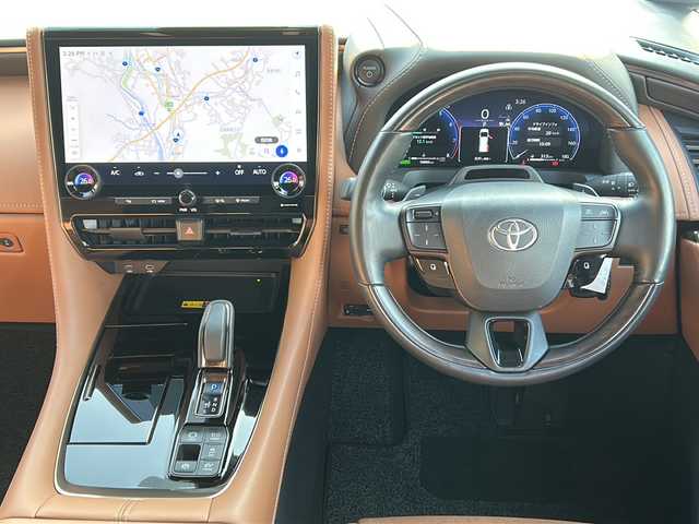 トヨタ ヴェルファイア ハイブリット Z プレミア 広島県 2024(令6)年 1.7万km プラチナホワイトパールマイカ 左右独立ムーンルーフ/トヨタチームメイト/・アドバンストパーク/・パーキングサポートブレーキ（周辺静止物）/・アドバンストドライブ/・緊急時操舵支援/・フロントクロストラフィックアラート/・レーンチェンジアシスト/・ドライバーモニターカメラ/セーフティセンス/・プリクラッシュセーフティ/・レーントレーシングアシスト/・全車速追従機能付レーダークルーズコントロール/・アダプティブハイビームシステム/・ロードサインアシスト/・ドライバー異常時対応システム/・プロアクティブドライビングアシスト/・発進遅れ告知機能/BSM/パーキングサポートブレーキ/デジタルインナーミラー/ドラレコ/純正14インチディスプレイオーディオナビ/・地デジTV/・ETC2.0/パノラミックビューモニター/HUD/両側パワースライドドア/パワーバックドア/サンセットブラウンプレミアムナッパ革シート/シートヒーター/ベンチレーション/パワーシート/メモリーシート/ステアリングヒーター/ステアリングスイッチ/おくだけ充電/フロアマット/ドアバイザー/スマートキー/スペアキー