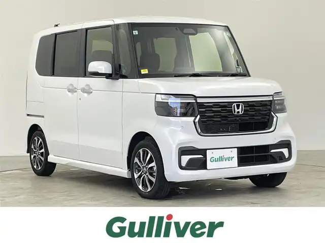 ホンダ Ｎ ＢＯＸ カスタム 千葉県 2024(令6)年 0.6万km プラチナホワイトパール 禁煙車/ホンダセンシング/・衝突軽減ブレーキ/・誤発進抑制機能/・後方誤発進抑制機能/・近距離衝突軽減ブレーキ/・急アクセル抑制機能/左側パワースライド/純正ナビ/CD/DVD/Bluetooth/バックカメラ/レーダークルーズコントロール/LEDヘッドライト/シートヒーター/純正14インチアルミホイール/オートエアコン/アイドリングストップ/USBポート/プッシュスタート/スマートキー