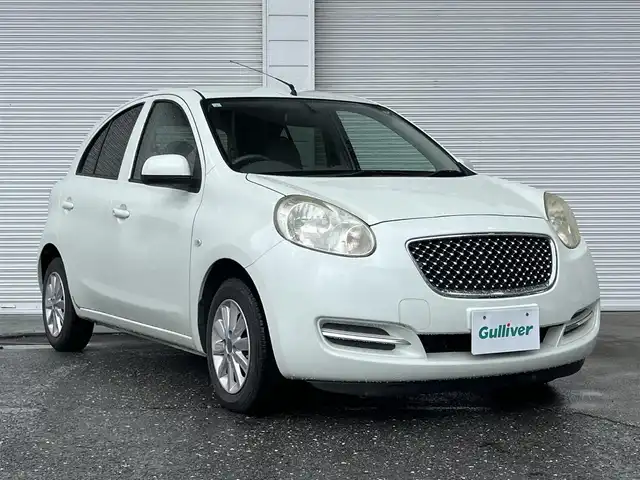 日産 マーチ ボレロ 高知県 2013(平25)年 6.7万km ホワイトパール 純正ナビ/ワンセグテレビ/バックカメラ/アイドリングストップ/スマートキー/AAC/フロアマット/純正16インチアルミホイール/盗難防止装置/運転席＋助手席エアバック/電格ミラー/本革ステアリング/スマートキー
