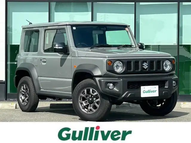 スズキ ジムニー シエラ JC 和歌山県 2025(令7)年 0.2万km ミディアムグレー 10インチディスプレイオーディオ/（Youtube/AppleCarPlay/AndroidAuto）/衝突軽減ブレーキ/レーンキープアシスト/横滑り防止機能/アイドリングストップ/コーナーセンサー/ダウンヒルアシストコントロール/シートヒーター/4WD/クルーズコントロール/LEDヘッドライト/オートライト/フォグランプ/ステアリングリモコン/プッシュスタート/スマートキー