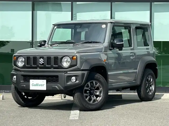 スズキ ジムニー シエラ JC 和歌山県 2025(令7)年 0.2万km ミディアムグレー 10インチディスプレイオーディオ/（Youtube/AppleCarPlay/AndroidAuto）/衝突軽減ブレーキ/レーンキープアシスト/横滑り防止機能/アイドリングストップ/コーナーセンサー/ダウンヒルアシストコントロール/シートヒーター/4WD/クルーズコントロール/LEDヘッドライト/オートライト/フォグランプ/ステアリングリモコン/プッシュスタート/スマートキー
