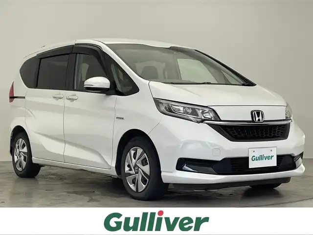 ホンダ フリード ハイブリット G ホンダセンシング 滋賀県 2020(令2)年 7万km プラチナホワイトパール 純正9インチナビ/【Bluetooth/CD/DVD/フルセグTV】/両側パワースライド/バックカメラ/追従クルーズコントロール/リアソナー/LEDヘッドライト/オートライト/ビルトインETC/前方ドライブレコーダー/プッシュスタート/スマートキー/ステアリングリモコン