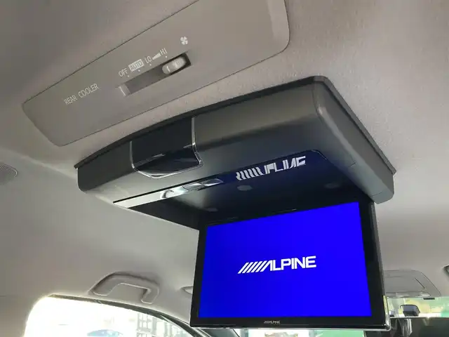 トヨタ ヴォクシー ZS 煌 香川県 2015(平27)年 12万km ホワイトパールクリスタルシャイン 登録時走行距離：119662km/アルパイン9型SDナビ/　CD DVD BT フルセグTV/バックカメラ/アルパイン10.1型フリップダウンモニター/両側パワースライドドア/LEDヘッドライト/オートライト/フォグランプ/MTモード付AT/ビルトインETC/ドライブレコーダー/ロールサンシェード/ISOFIX/ウォークスルー/革巻きステアリング/ステアリングスイッチ/プッシュスタート/スマートキー/スペアキー