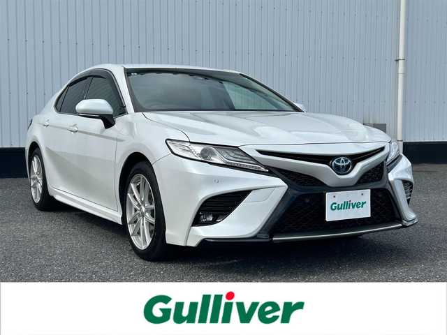 トヨタ カムリ WSレザーパッケージ 千葉県 2021(令3)年 5.5万km プラチナホワイトパールマイカ ディスプレイオーディオ　8インチ/(TV/CD/DVD/Bluetooth/ナビキッド有)/バックカメラ/衝突被害軽減システム/車線逸脱警報/クルーズコントロール/レザーシート/横滑り防止装置/ETC/アイドリングストップ/LEDヘッドライト/フォグランプ/オートライト/ウィンカーミラー/電動格納ミラー/社外18インチAW/シートヒーター/シートリフター/プッシュスタート/スマートキー/フロアマット/ドアバイザー/取扱説明書/保証書