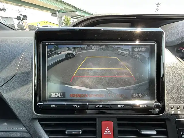 トヨタ エスクァイア Gi 愛知県 2018(平30)年 2.6万km ホワイトパールクリスタルシャイン モデリスタエアロ（F・S・R）/純正9インチSDナビ/フルセグTV/BT/HDMI/バックカメラ/純正フリップダウンモニター/ビルトインETC/純正15インチAW/トヨタセーフティセンス/クルーズコントロール/前後ドライブレコーダー/両側パワースライドドア /レザーシート/前席シートヒーター/純正フロアマット/取説、保証書/スペアキー