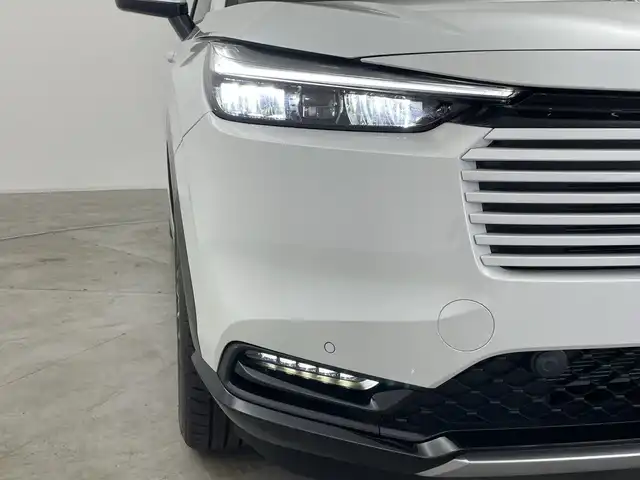 ホンダ ヴェゼル ハイブリッド e:HEV Z 群馬県 2025(令7)年 0.1千km プラチナホワイトパール 登録済未使用車　純正９型ナビ　バックカメラ　電動リアゲート　ハーフレザー　シートヒーター　ハンドルヒーター　置くだけ充電　アダプティブクルーズコントロール　ＢＳＭ　ＥＴＣ２．０　ＬＥＤライト　禁煙車