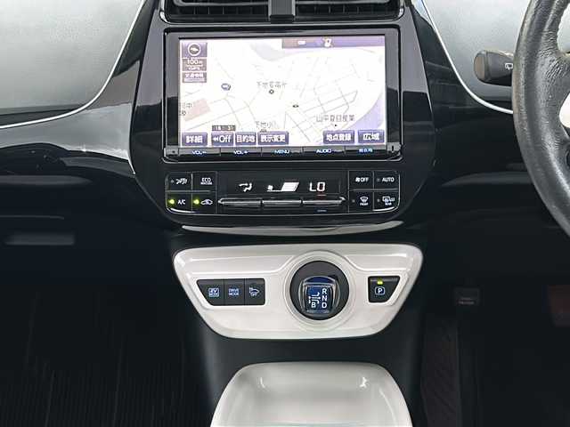 トヨタ プリウス A 愛知県 2016(平28)年 11.5万km スティールブロンドM 登録時走行距離114381km/ワンオーナー/純正9インチメモリナビ/（Bluetooth/フルセグTV/DVD/AM/FM)/バックカメラ/インテリジェントクリアランスソナー/サンルーフ/トヨタセーフティーセンス/プリクラッシュセーフティー/レーンディパーチャーアラート/ブラインドスポットモニター/インテリジェントパーキングアシスト/ヘッドアップディスプレイ/オートマッチハイビーム/純正ドアバイザー/純正フロアマット/ビルドインETC/テレビキャンセラー/スマートキー/（スペアキー×１）/保証書
