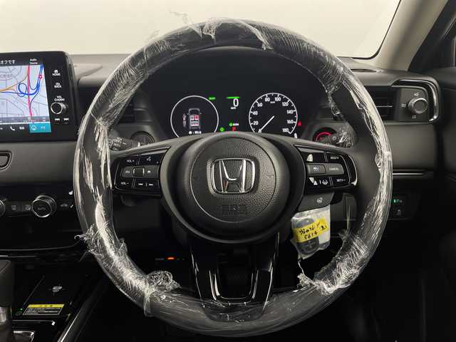 ホンダ ヴェゼル ハイブリッド e:HEV Z 新潟県 2025(令7)年 0.1千km クリスタルブラックパール ホンダセンシング/ワイヤレス充電器/シーケンシャルウィンカー/純正ナビ/　フルセグTV/Bluetooth/AppleCarPlay/AndroidAuto/バックカメラ/パワーバックドア/フットオープナー/レーダークルーズコントロール/LEDオートライト/ハーフレザーシート/シートヒーター/純正18インチアルミホイール/パドルシフト/ブラインドスポットモニター/ステアリングリモコン/ステアリングヒーター/ビルトインETC2.0