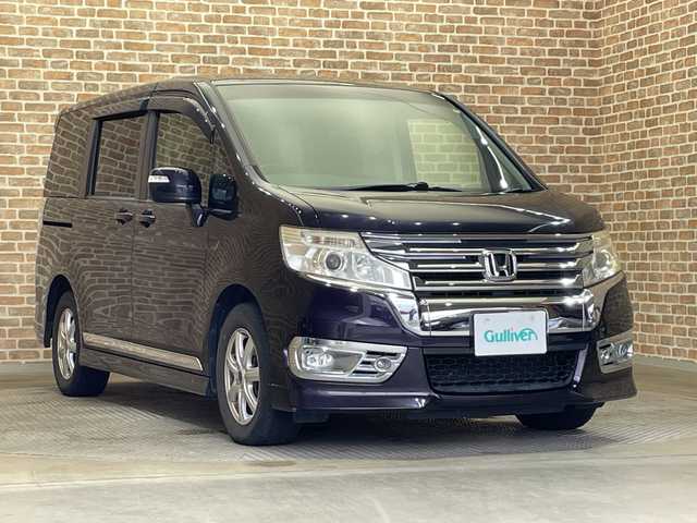ホンダ ステップワゴン スパーダ S 岩手県 2013(平25)年 12.1万km プレミアムコスミックバイオレットパール ４WD/横滑り防止装置/アイドリングストップ/パドルシフト/ヒルスタートアシスト機能/カロッツェリアサブウーファー/純正ナビ/フルセグTV/バックカメラ/ETC/本革巻きステアリグ/ヒーテッドドアミラー/オートライト/ディスチャージヘッドランプ/フォグランプ/純正フロアマット/純正アルミホイール積み込みあり