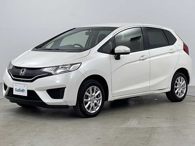 ホンダ フィット 13G Fパッケージ 道央・札幌 2013(平25)年 11.6万km プレミアムホワイトパール ・純正ナビＴＶ、ＢＴ、ＤＶＤ、ＣＤ/・バックカメラ/・アイドリングストップ/・横滑り防止機能/・電動格納ミラー/・ドアミラーウィンカー・ヒーター付/・フロントワイパーデアイサー/・純正リモコンスターター/・スマートキー/・ワンオーナー