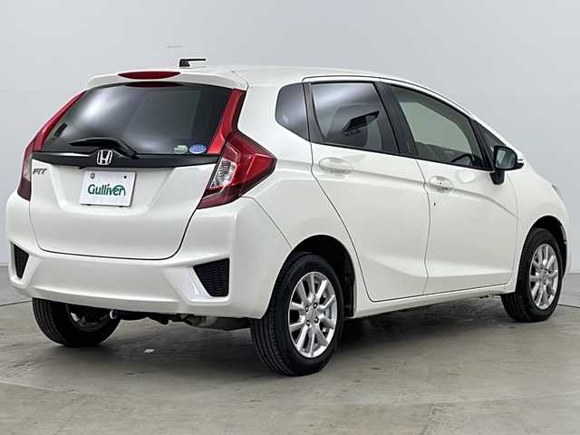 ホンダ フィット 13G Fパッケージ 道央・札幌 2013(平25)年 11.6万km プレミアムホワイトパール ・純正ナビＴＶ、ＢＴ、ＤＶＤ、ＣＤ/・バックカメラ/・アイドリングストップ/・横滑り防止機能/・電動格納ミラー/・ドアミラーウィンカー・ヒーター付/・フロントワイパーデアイサー/・純正リモコンスターター/・スマートキー/・ワンオーナー
