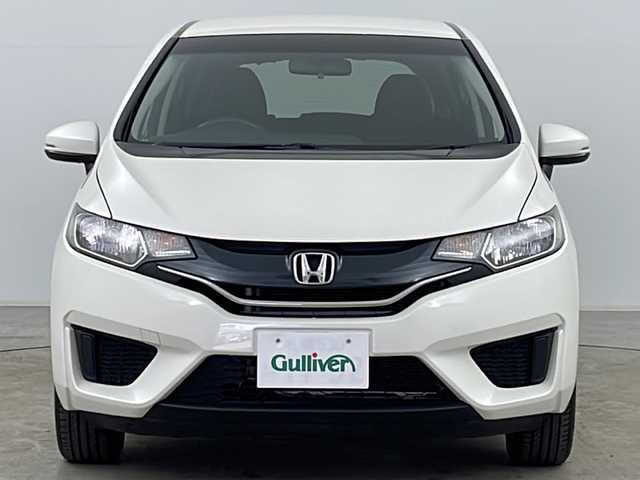ホンダ フィット 13G Fパッケージ 道央・札幌 2013(平25)年 11.6万km プレミアムホワイトパール ・純正ナビＴＶ、ＢＴ、ＤＶＤ、ＣＤ/・バックカメラ/・アイドリングストップ/・横滑り防止機能/・電動格納ミラー/・ドアミラーウィンカー・ヒーター付/・フロントワイパーデアイサー/・純正リモコンスターター/・スマートキー/・ワンオーナー